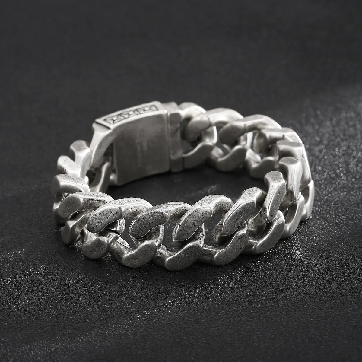 silver cuban chain ring hip hop jewelry textured background