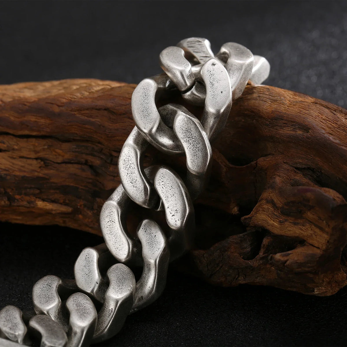 silver cuban link bracelet chunky hip hop chain dark background