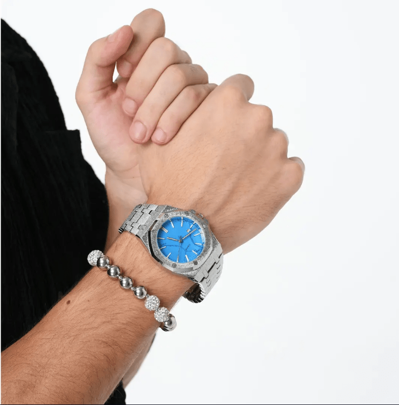 turquoise dial waffle watch on hand icegang silver luxury statement watch white background